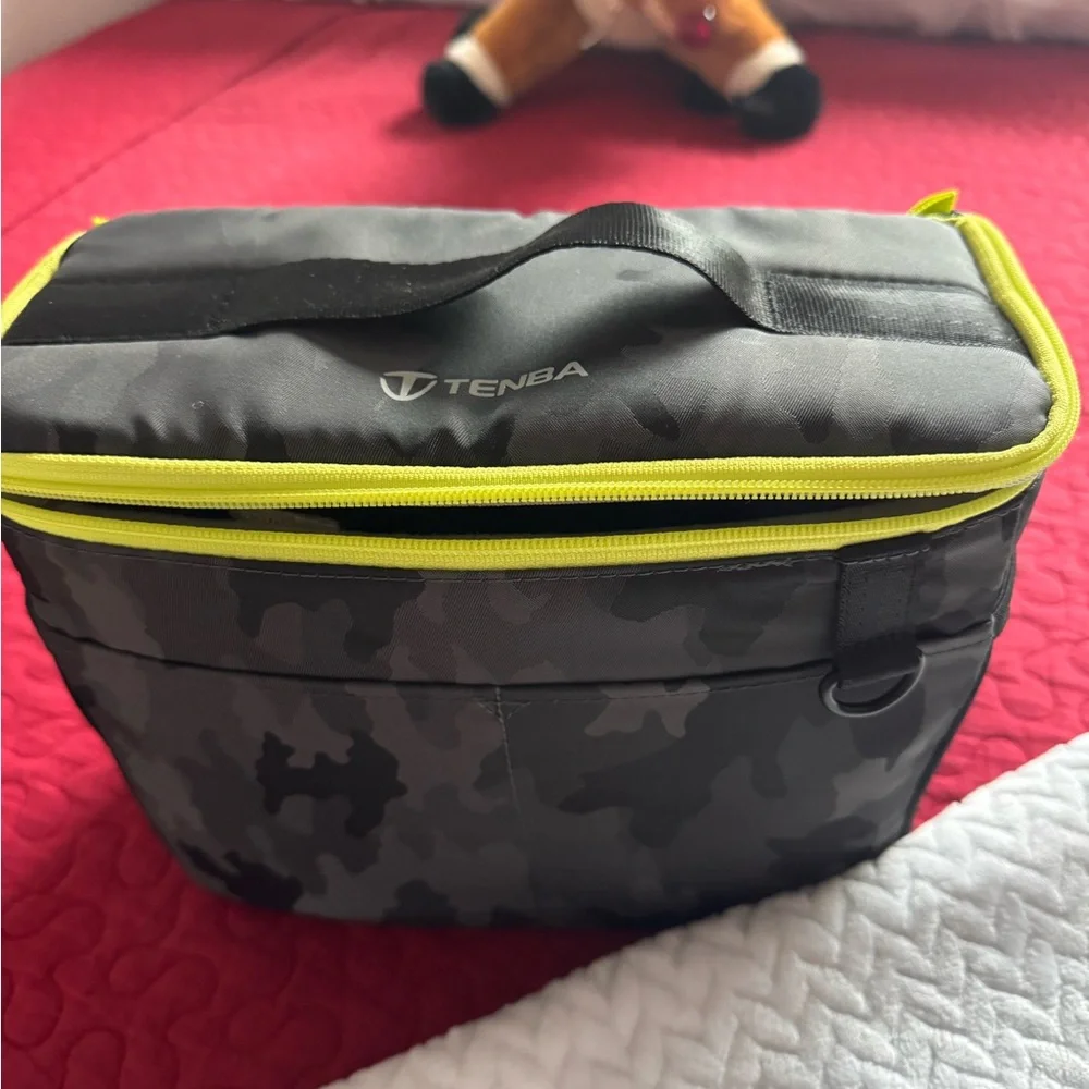Canon EOS Camera with Black and Yellow Bag